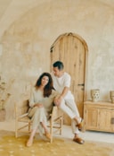 Benoit Pellegrini and Benedicta Linares Pearce seated together inside Son Blanc farmhouse in Menorca.