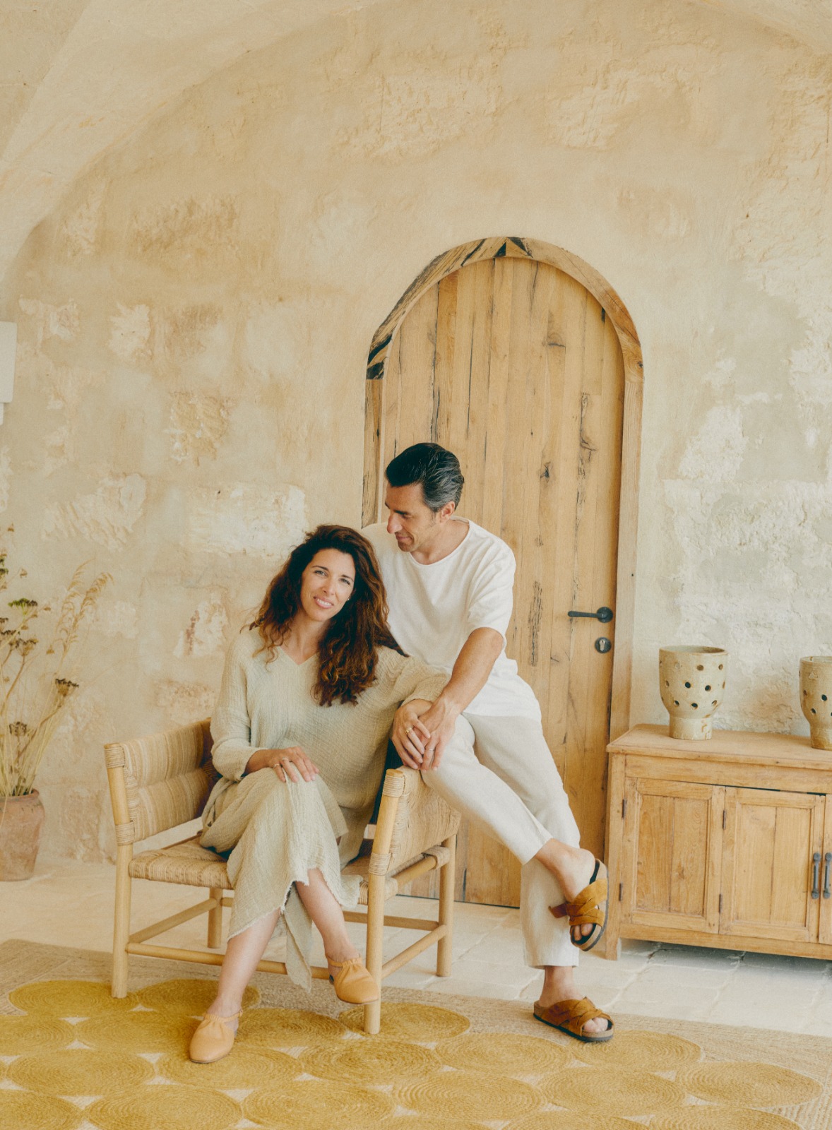 Benoit Pellegrini and Benedicta Linares Pearce seated together inside Son Blanc farmhouse in Menorca.